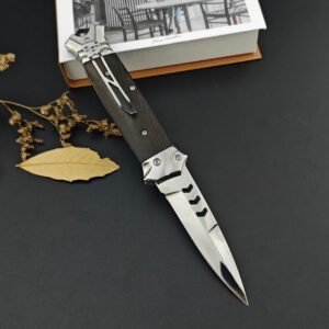 The New Version Of The Bouncy Fish Side-jumping Has A Brown Handle And A Chicken Wing Wood Handle Switchblade