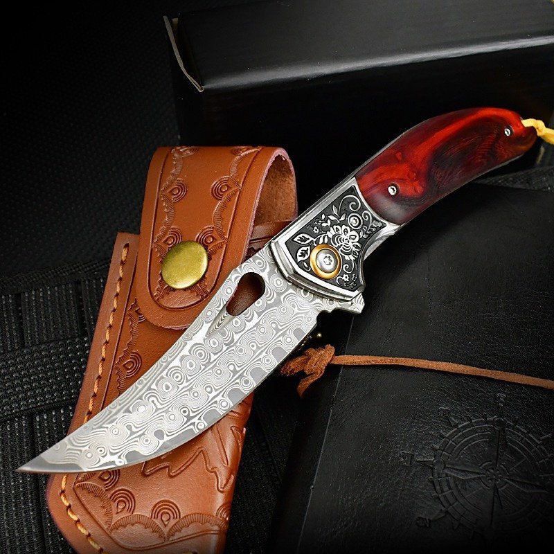 67376823-de01-41ef-8ece-90f5b5a86cde.jpeg.suffix.jpeg Sabertooth Tiger Damascus Folding Knife