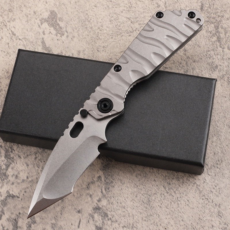 6a9ef05a-a60b-4cec-a992-46dff1f76024.jpeg The Advancer Is A Stone Wash, Concave Grinding, Titanium Handle Folding Knife