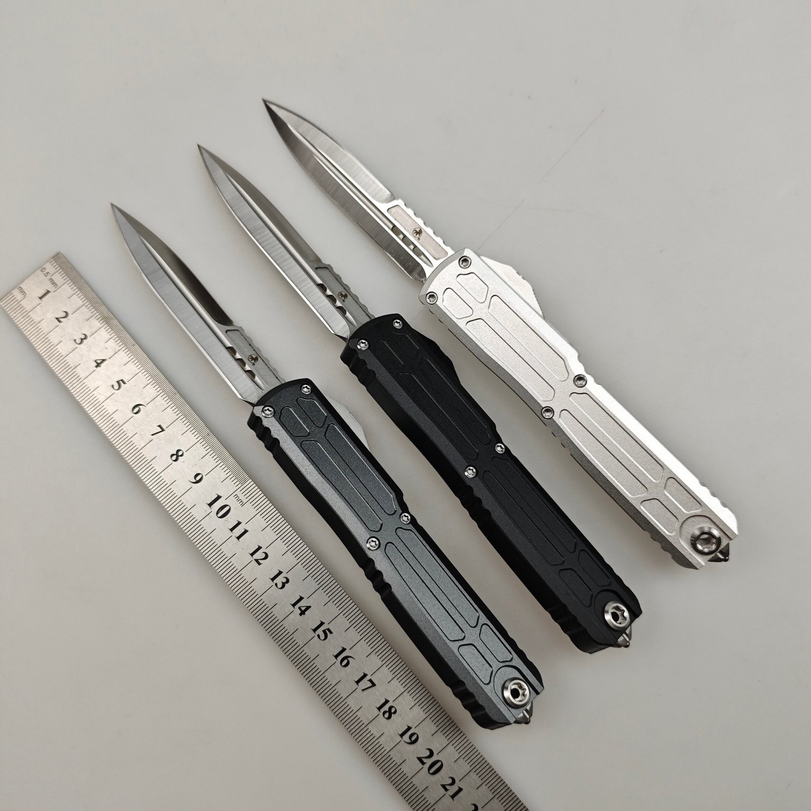 90f332cb-255d-443b-a03c-7e161cb4792c.jpeg Microtech UT-EX OTF Knife with Dagger-Logo Pocket Clip